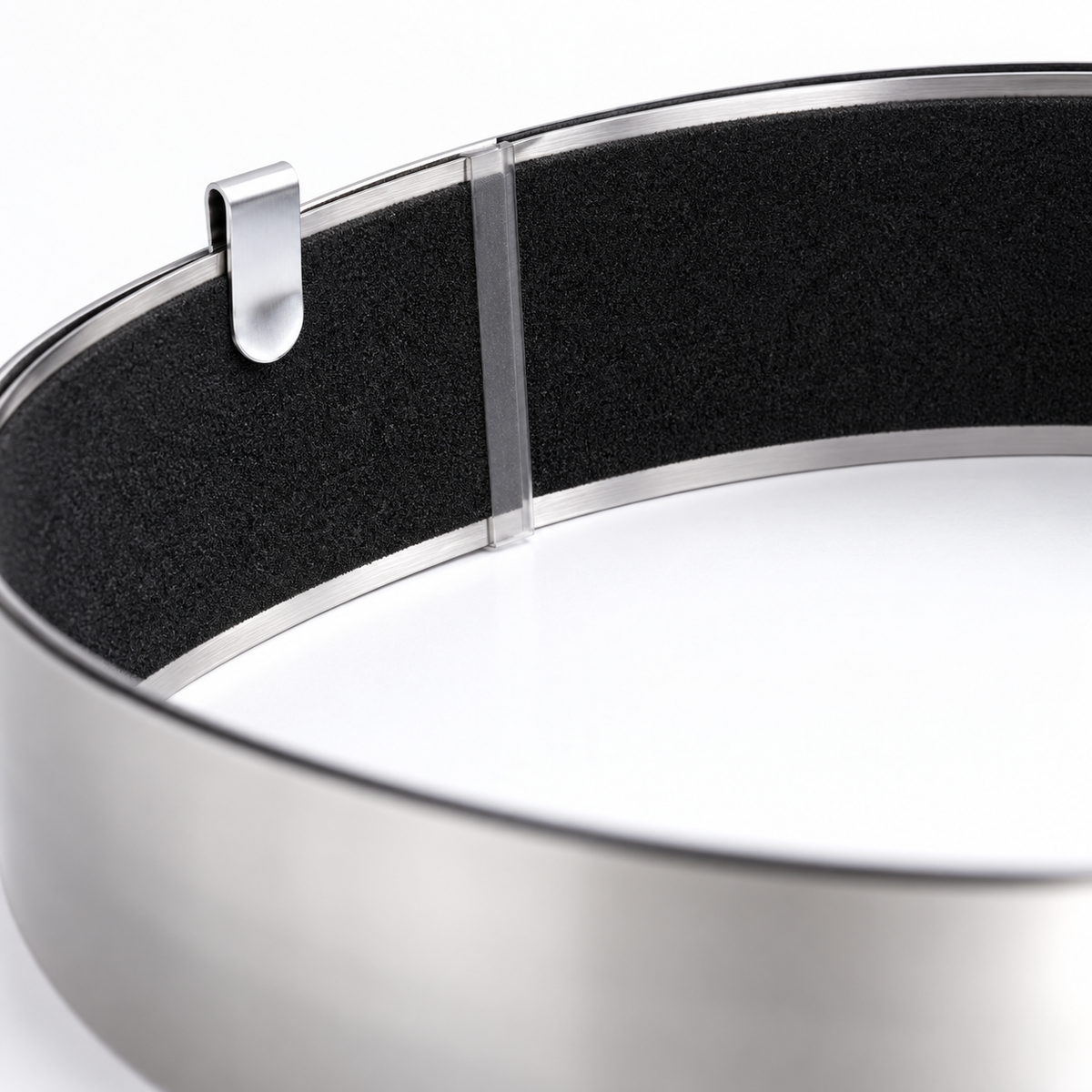 Close-up of the black non-slip backing and retaining clip on a Pajarito steel straight edge.