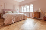 Deco Natural Oak herringbone in a pink bedroom