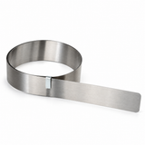 Janser flexible steel straight edge partly unrolled with retaining clip on a white background.
