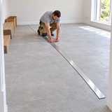 Pajarito straight edge used for centre-line marking before fitting parquet-effect vinyl flooring.