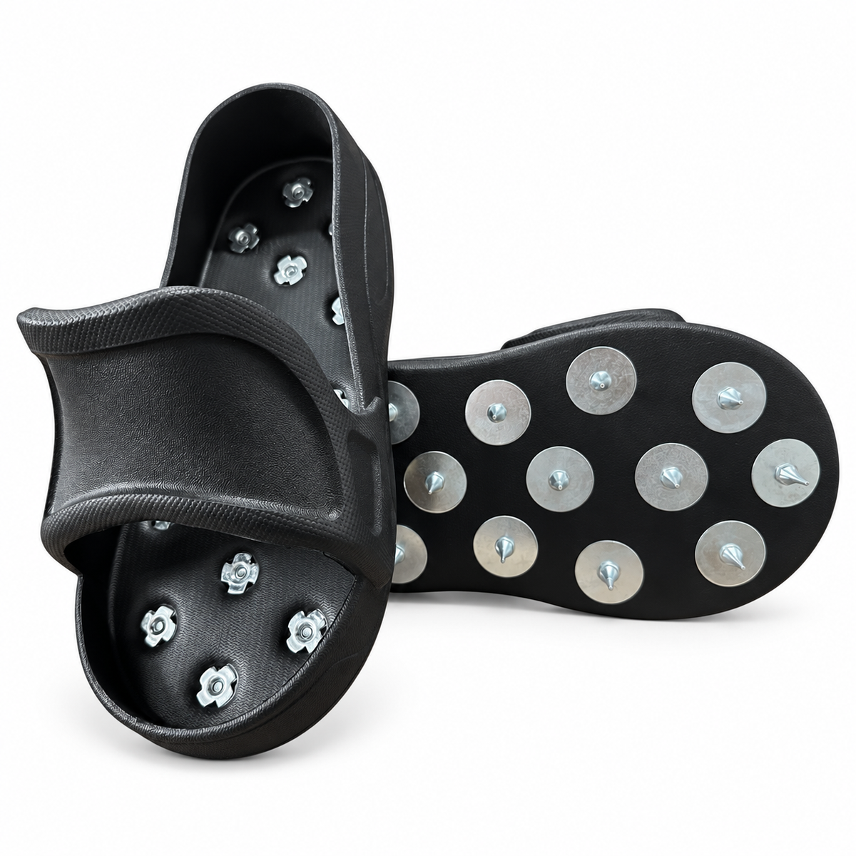 Pair of black slip-on spiked overshoes showing the upper and metal-spiked underside