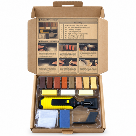 Open wood floor repair kit containing 11 wax blocks, a melting tool, scrapers, sponges and cloth.